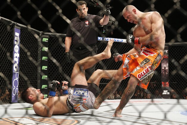 Donald Cerrone kicks Myles Jury during their lightweight mixed martial arts bout at UFC 182 Saturday, Jan. 3, 2015, in Las Vegas. (AP Photo/John Locher)