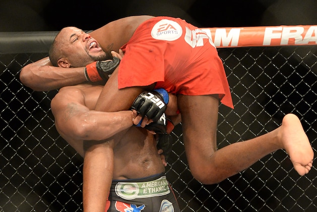 Jan 3, 2015; Las Vegas, NV, USA; Jon Jones (red gloves) and Daniel Cormier (blue gloves) compete during their light heavyweight title fight at UFC 182 at the MGM Grand Garden Arena. Jones won. Mandatory Credit: Jayne Kamin-Oncea-USA TODAY Sports