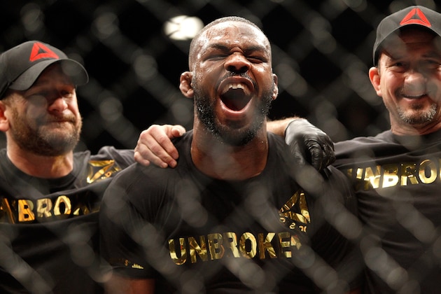 LAS VEGAS, NV - JANUARY 03:  Jon Jones (C) yells out after defeating Daniel Comier in a light heavyweight title fight at the MGM GrandGarden Arena on January 3, 2015 in Las Vegas, Nevada. Jones retained his title by unanimous decision.  (Photo by Steve Marcus/Getty Images)