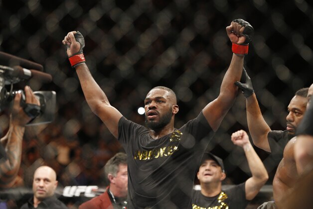 Jon Jones celebrates after defeating Daniel Cormier during their light heavyweight title mixed martial arts bout at UFC 182, Saturday, Jan. 3, 2015, in Las Vegas. (AP Photo/John Locher)