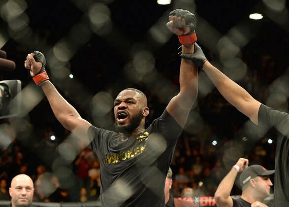 Jan 3, 2015; Las Vegas, NV, USA; Jon Jones (red gloves) celebrates after defeating Daniel Cormier (not pictured) in their light heavyweight title fight at UFC 182 at the MGM Grand Garden Arena. Jones won. Mandatory Credit: Jayne Kamin-Oncea-USA TODAY Sports