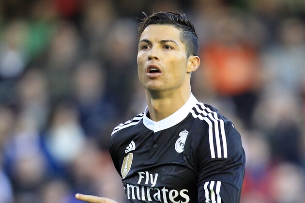 Real Madrid's Cristiano Ronaldo celebrates after scoring against Valencia during a Spanish La Liga soccer match at the Mestalla stadium in Valencia, Spain, on Sunday, Jan. 4, 2015.(AP Photo/Alberto Saiz)