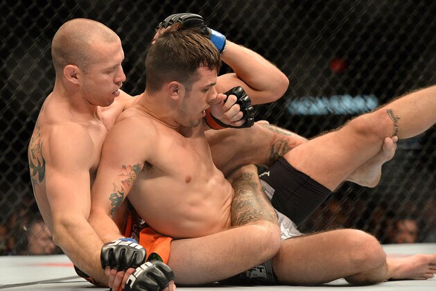 Jan 3, 2015; Las Vegas, NV, USA; Donald Cerrone (red gloves) and Myles Jury (blue gloves) in their lightweight bout at UFC 182 at MGM Grand Garden Arena. Mandatory Credit: Jayne Kamin-Oncea-USA TODAY Sports