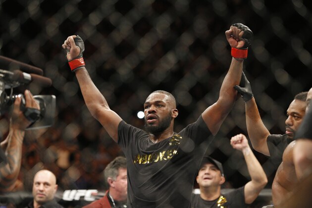 Jon Jones celebrates after defeating Daniel Cormier during their light heavyweight title mixed martial arts bout at UFC 182, Saturday, Jan. 3, 2015, in Las Vegas. (AP Photo/John Locher)