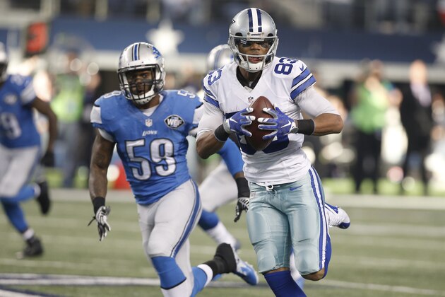 Dallas Cowboys wide receiver Terrance Williams (83) runs back a touchdown against the Detroit Lions during the first half of an NFL wildcard playoff football game, Sunday, Jan. 4, 2015, in Arlington, Texas. (AP Photo/Brandon Wade)