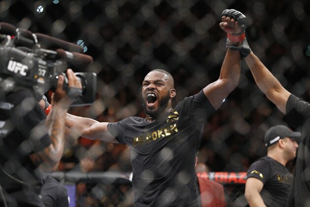 Jon Jones celebrates after defeating Daniel Cormier during their light heavyweight title mixed martial arts bout at UFC 182, Saturday, Jan. 3, 2015, in Las Vegas. (AP Photo/John Locher)