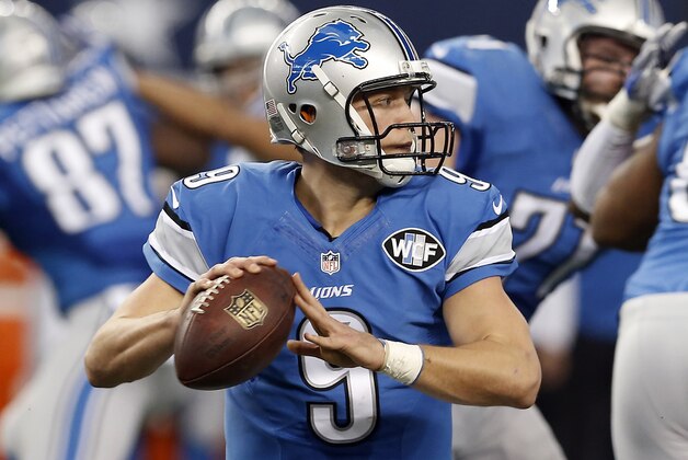 Detroit Lions quarterback Matthew Stafford (9) looks to throw a pass during the first half of an NFL wildcard playoff football game against the Dallas Cowboys, Sunday, Jan. 4, 2015, in Arlington, Texas. (AP Photo/Brandon Wade)