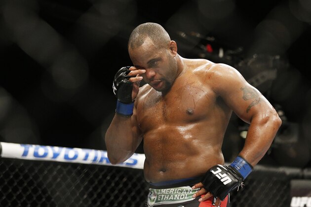 Daniel Cormier rubs his eye after he was poked in the eye by Jon Jones during their light heavyweight title mixed martial arts bout at UFC 182, Saturday, Jan. 3, 2015, in Las Vegas. (AP Photo/John Locher)