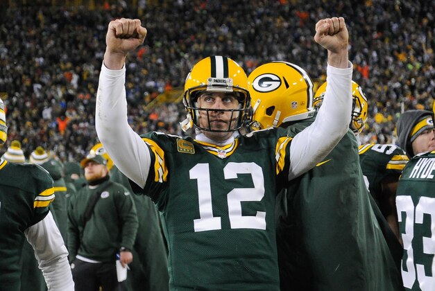 Dec 28, 2014; Green Bay, WI, USA; Green Bay Packers quarterback Aaron Rodgers (12) reacts after officials ruled a 2-point conversion attempt by the Detroit Lions failed in the fourth quarter at Lambeau Field. Mandatory Credit: Benny Sieu-USA TODAY Sports
