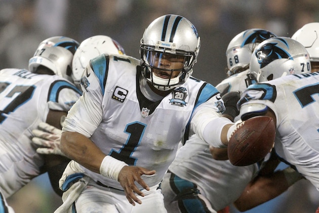 Carolina Panthers quarterback Cam Newton (1) works against the Arizona Cardinals in the second half of an NFL wild card playoff football game in Charlotte, N.C., Saturday, Jan. 3, 2015. (AP Photo/Bob Leverone)