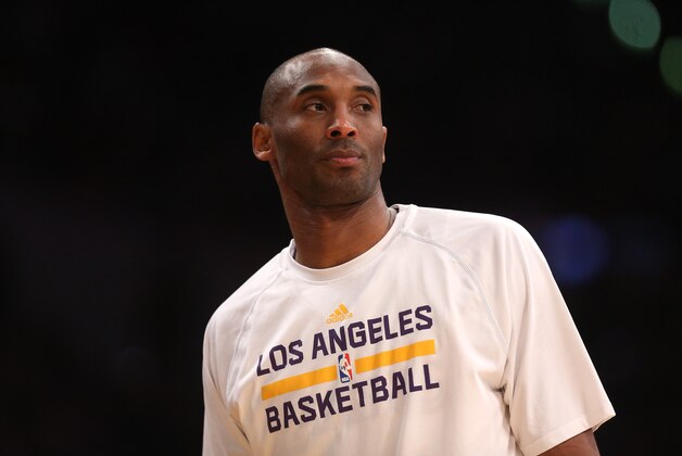 LOS ANGELES, CA - JANUARY 04:  Kobe Bryant #24 of the Los Angeles Lakers looks on from the bench during the game against the Indiana Pacers at Staples Center on January 4, 2015 in Los Angeles, California.The Lakers won 88-87.  NOTE TO USER: User expressly acknowledges and agrees that, by downloading and or using this photograph, User is consenting to the terms and conditions of the Getty Images License Agreement.  (Photo by Stephen Dunn/Getty Images)
