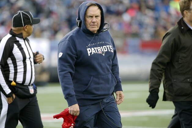 New England Patriots head coach Bill Belichick leaves the field after in an NFL football game against the Buffalo Bills Sunday, Dec. 28, 2014, in Foxborough, Mass. The Bills won the game 17-9. (AP Photo/Elise Amendola)