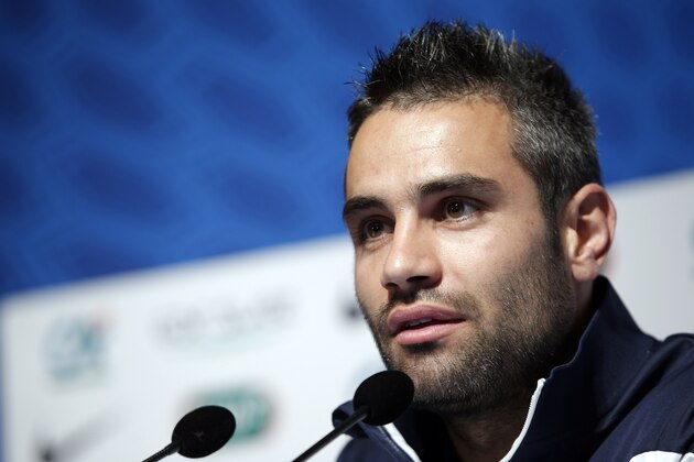 France's soccer player Loic Perrin answers a reporter during a press conference at the Clairefontaine training center, outside Paris, Friday, May 23, 2014. France are preparing for the upcoming soccer World Cup in Brazil starting on 12 June. (AP Photo/Christophe Ena)