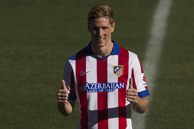 Spanish forward Fernando Torres poses for the photographers during his Atletico Madrid's official presentation at the Vicente Calderon stadium in Madrid, Spain, Sunday, Jan. 4, 2015. (AP Photo/Andres Kudacki)