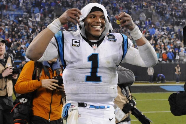 Carolina Panthers' Cam Newton celebrates after the second half of an NFL wild card playoff football game against the Arizona Cardinals in Charlotte, N.C., Saturday, Jan. 3, 2015. Carolina Panthers won 27-16. (AP Photo/Mike McCarn)