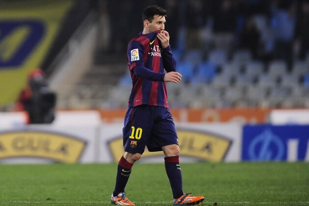 Barcelona's Lionel Messi of Argentina leaves the pitch at the end of the match during their La Liga soccer match against Real Sociedad, at Anoeta stadium in San Sebastian, northern Spain, Sunday, Jan.4, 2015.  Barcelona lose the match 1-0.(AP Photo/Alvaro Barrientos)