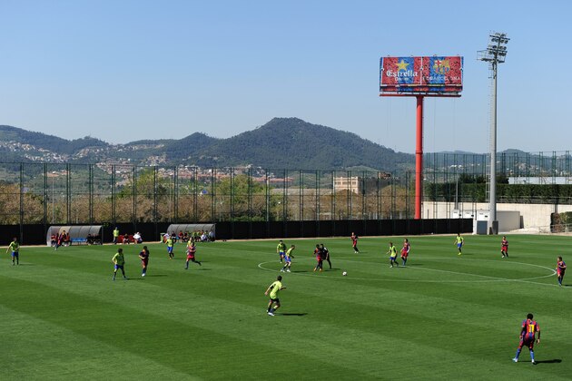 BARCELONA, SPAIN - APRIL 09:  Barcelona youth players play a match on one of the pitches at the Joan Camper training ground on April 9, 2011 in Barcelona, Spain. Every weekend various teams of Barcelona youth players play in matches with the hope of one day making it to the top. (Photo by Jasper Juinen/Getty Images)