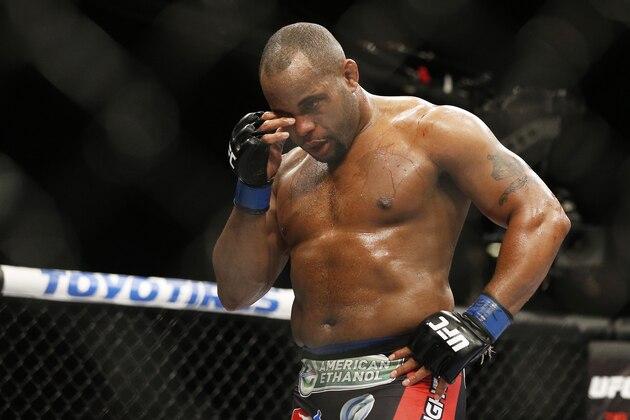 Daniel Cormier rubs his eye after he was poked in the eye by Jon Jones during their light heavyweight title mixed martial arts bout at UFC 182, Saturday, Jan. 3, 2015, in Las Vegas. (AP Photo/John Locher)