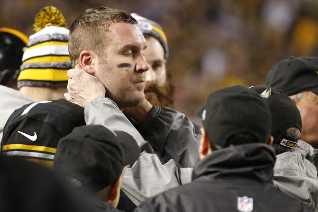Pittsburgh Steelers quarterback Ben Roethlisberger (7) has his neck examined on the sideline by a team doctor after being shaken up on a sack during the fourth quarter of an NFL wildcard playoff football game against the Baltimore Ravens, Saturday, Jan. 3, 2015, in Pittsburgh. Roethlisberger re-entered the game after three plays. The Steelers lost, 30-17. (AP Photo/Gene J. Puskar)