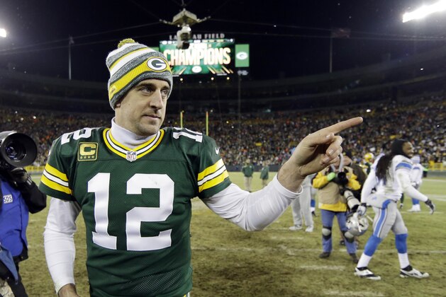 Green Bay Packers' Aaron Rodgers walks off the field after an NFL football game against the Detroit Lions Sunday, Dec. 28, 2014, in Green Bay, Wis. The Packers won 30-20. (AP Photo/Tom Lynn)