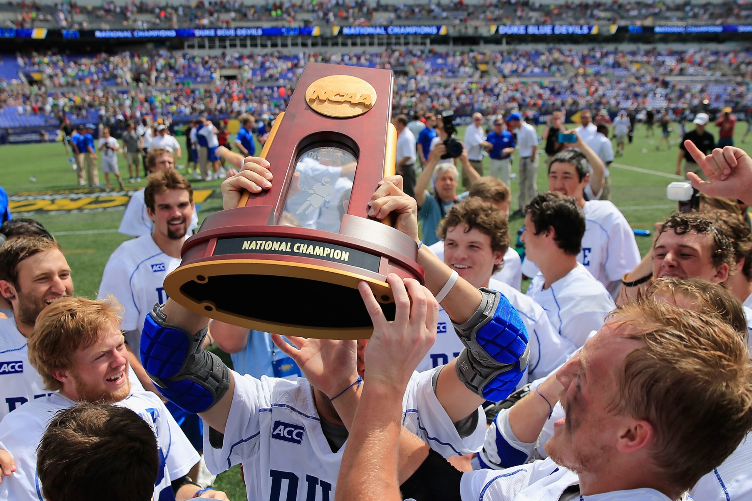 BALTIMORE, MD - MAY 26:  Members of the Duke Blue Devils celerate after defeating the Notre Dame Fighting Irish 11-9 to win the 2014 NCAA Division I Men's Lacrosse Championship at M&T Bank Stadium on May 26, 2014 in Baltimore, Maryland.  (Photo by Rob Carr/Getty Images)