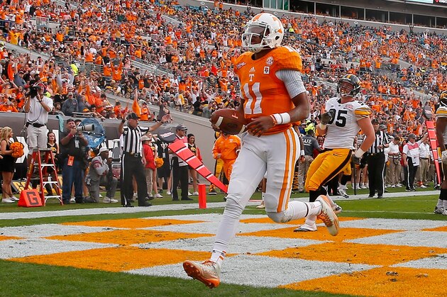 JACKSONVILLE, FL - JANUARY 02:  Joshua Dobbs #11 of the Tennessee Volunteers crosses the goal line for a touchdown during the TaxSlayer Bowl against the Iowa Hawkeyes at EverBank Field on January 2, 2015 in Jacksonville, Florida.  (Photo by Sam Greenwood/Getty Images)