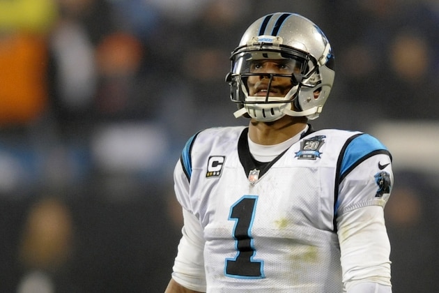 Carolina Panthers quarterback Cam Newton (1) walks on the field against the Arizona Cardinals in the second half of an NFL wild card playoff football game in Charlotte, N.C., Saturday, Jan. 3, 2015. (AP Photo/Mike McCarn)