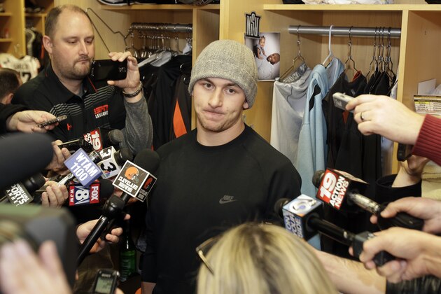 Cleveland Browns quarterback Johnny Manziel talks with the media at the NFL football team's training camp, Monday, Dec. 29, 2014, in Berea, Ohio.  Along with key injuries and late-game collapses, the Browns' seventh straight losing season was undermined by the antics of wide receiver Josh Gordon, Manziel and cornerback Justin Gilbert. Owner Jimmy Haslam promised the organization will weed out any problem players. (AP Photo/Tony Dejak)
