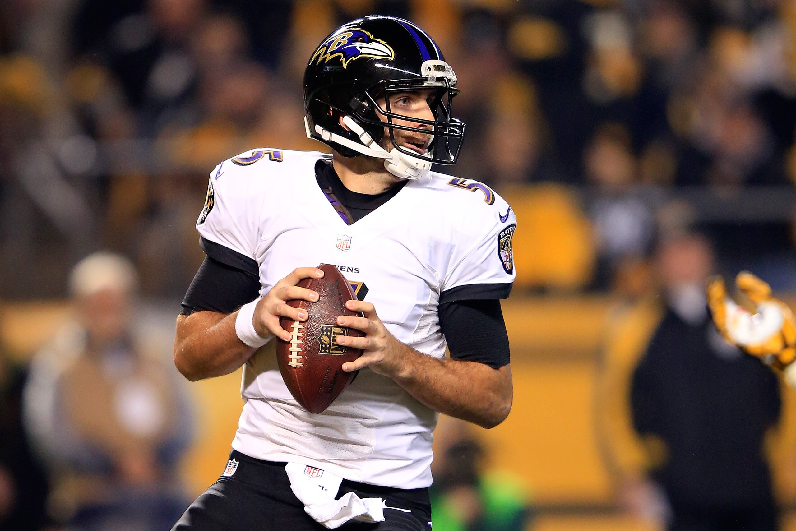 PITTSBURGH, PA - JANUARY 03:  Joe Flacco #5 of the Baltimore Ravens drops back to pass in the first quarter against the Pittsburgh Steelers during their AFC Wild Card game at Heinz Field on January 3, 2015 in Pittsburgh, Pennsylvania.  (Photo by Jamie Squire/Getty Images)