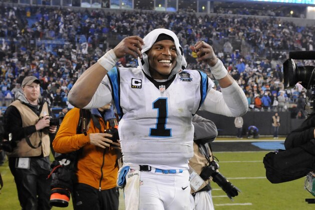 Carolina Panthers' Cam Newton celebrates after the second half of an NFL wild card playoff football game against the Arizona Cardinals in Charlotte, N.C., Saturday, Jan. 3, 2015. Carolina Panthers won 27-16. (AP Photo/Mike McCarn)