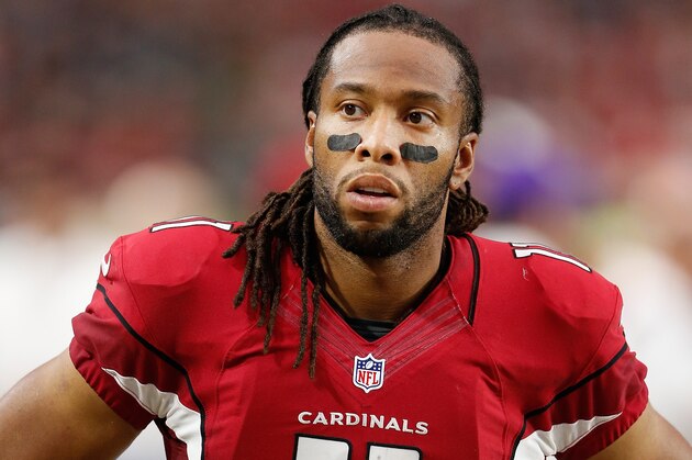 GLENDALE, AZ - DECEMBER 07:  Wide receiver Larry Fitzgerald #11 of the Arizona Cardinals reacts on the sidelines during the third quarter of the NFL game against the Kansas City Chiefs at the University of Phoenix Stadium on December 7, 2014 in Glendale, Arizona. The Cardinals defeated the Chiefs 17-14.  (Photo by Christian Petersen/Getty Images)