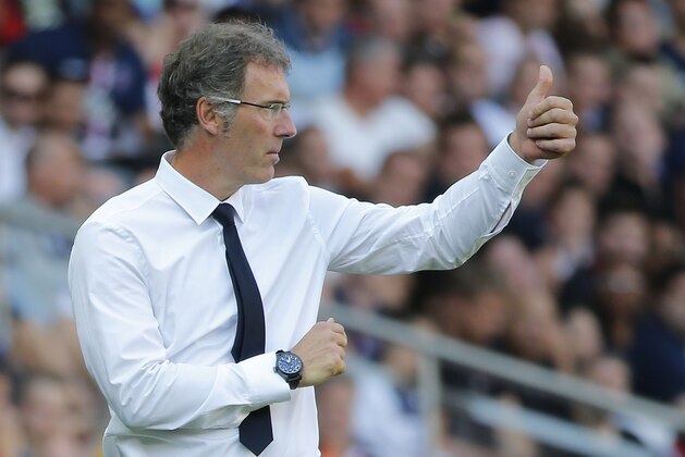 Paris Saint Germain's coach Laurent Blanc gives a thump up during a French League One soccer Match Paris Saint Germain against Bastia, at Parc des Princes stadium, in Paris, Saturday, Aug. 16. 2014. Paris Saint Germain won 2-0. (AP Photo/Michel Euler) Paris Saint Germain's coach Laurent Blanc gives a thump up during a French League One soccer Match Paris Saint Germain against Bastia, at Parc des Princes stadium, in Paris, Saturday, Aug. 16. 2014. Paris Saint Germain won 2-0. (AP Photo/Michel Euler)