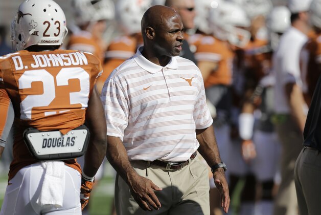 Texas Longhorns head coach Charlie Strong watches his team prior to an NCAA college football game against West Virginia, Saturday, Nov. 8, 2014, in Austin, Texas. (AP Photo/Eric Gay)