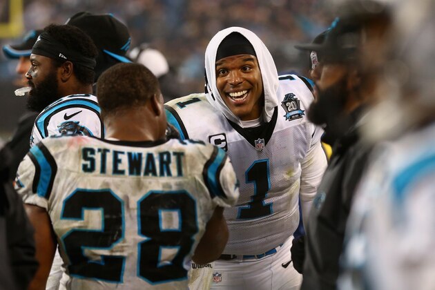 CHARLOTTE, NC - JANUARY 03:  Cam Newton #1 and  Jonathan Stewart #28 of the Carolina Panthers celebrate their 27-16 victory over the Arizona Cardinals after their NFC Wild Card Playoff game at Bank of America Stadium on January 3, 2015 in Charlotte, North Carolina.  (Photo by Streeter Lecka/Getty Images)