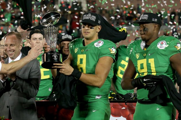 PASADENA, CA - JANUARY 01:  Quarterback Marcus Mariota #8 of the Oregon Ducks receives the Leishman Trophy after defeating the Florida State Seminoles 59-20 in the College Football Playoff Semifinal at the Rose Bowl Game presented by Northwestern Mutual at the Rose Bowl on January 1, 2015 in Pasadena, California.  (Photo by Stephen Dunn/Getty Images)