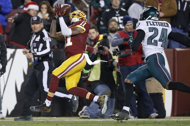 Washington Redskins wide receiver DeSean Jackson (11) pulls in a pass as Philadelphia Eagles cornerback Bradley Fletcher (24) closes in during the second half of an NFL football game in Landover, Md., Saturday, Dec. 20, 2014. (AP Photo/Alex Brandon)
