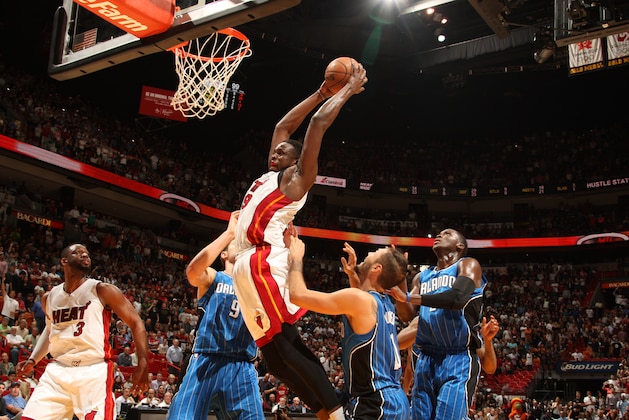 MIAMI, FL - DECEMBER 29:  Luol Deng #9 of the Miami Heat goes to the basket against the Orlando Magic on December 29, 2014 at American Airlines Arena in Miami, Florida.  NOTE TO USER: User expressly acknowledges and agrees that, by downloading and or using this Photograph, user is consenting to the terms and conditions of the Getty Images License Agreement. Mandatory Copyright Notice: Copyright 2014 NBAE (Photo by Issac Baldizon/NBAE via Getty Images)