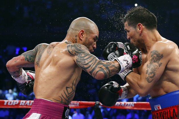 NEW YORK, NY - JUNE 07: Miguel Cotto of Puerto Rico (L) hits Sergio Martinez of Argentina in the jaw with a right punch during the second round as they battle for the WBC Middleweight Championship on June 7, 2014 at Madison Square Garden in New York City. Cotto won by a TKO in the tenth round. (Photo by Rich Schultz/Getty Images) NEW YORK, NY - JUNE 07: Miguel Cotto of Puerto Rico (L) hits Sergio Martinez of Argentina in the jaw with a right punch during the second round as they battle for the WBC Middleweight Championship on June 7, 2014 at Madison Square Garden in New York City. Cotto won by a TKO in the tenth round. (Photo by Rich Schultz/Getty Images)
