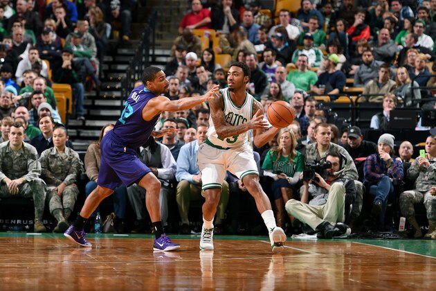 BOSTON, MA - JANUARY 5: James Young #13 of the Boston Celtics handles the ball against Gary Neal #12 of the Charlotte Hornets on January 5, 2015 at the TD Garden in Boston, Massachusetts. NOTE TO USER: User expressly acknowledges and agrees that, by downloading and or using this photograph, User is consenting to the terms and conditions of the Getty Images License Agreement. Mandatory Copyright Notice: Copyright 2015 NBAE  (Photo by Brian Babineau/NBAE via Getty Images)