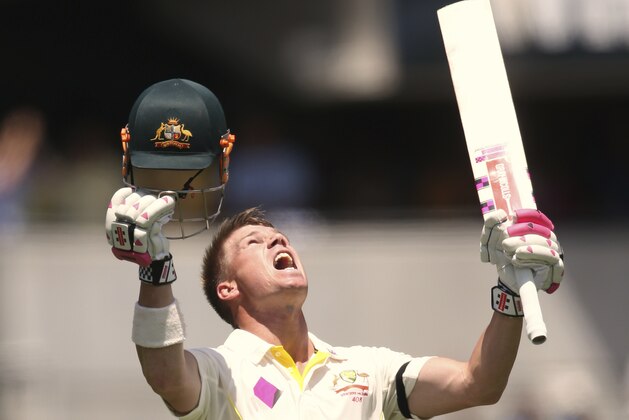 Australia's David Warner celebrates making 100 runs against India during their cricket test match in Sydney, Tuesday, Jan. 6, 2015. (AP Photo/Rick Rycroft)