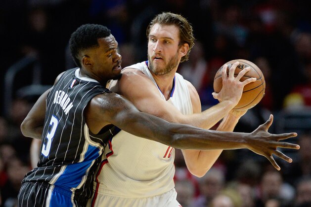 Dec 3, 2014; Los Angeles, CA, USA; Los Angeles Clippers forward Spencer Hawes (10) handles the ball as Orlando Magic center Dewayne Dedmon (3) defends during the first half at Staples Center. Mandatory Credit: Richard Mackson-USA TODAY Sports
