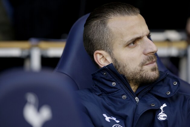 Tottenham Hotspur substitute Roberto Soldado sits on the sideline before the start of the English Premier League soccer match between Tottenham Hotspur and Burnley at White Hart Lane stadium in London, Saturday, Dec. 20, 2014.  (AP Photo/Matt Dunham)