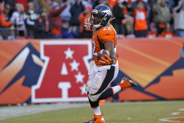 Denver Broncos running back C.J. Anderson celebrates his touchdown against the Oakland Raiders during the second half of an NFL football game, Sunday, Dec. 28, 2014, in Denver. (AP Photo/Jack Dempsey)