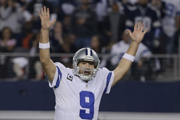 Dallas Cowboys quarterback Tony Romo (9) reacts to a touchdown during the second half of an NFL wildcard playoff football game against the Detroit Lions, Sunday, Jan. 4, 2015, in Arlington, Texas. (AP Photo/Tony Gutierrez)