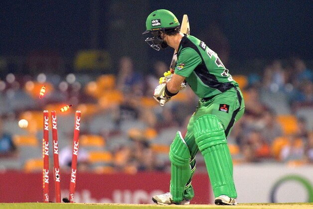 BRISBANE, AUSTRALIA - DECEMBER 28: Glenn Maxwell of the Stars is clean bowed off the bowling of Ryan Duffield of the Heat during the Big Bash League match between the Brisbane Heat and the Melbourne Stars at The Gabba on December 28, 2014 in Brisbane, Australia.  (Photo by Bradley Kanaris/Getty Images)