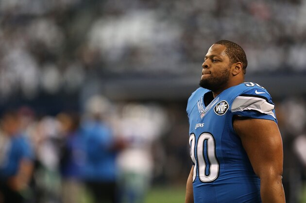 ARLINGTON, TX - JANUARY 04:  Ndamukong Suh #90 of the Detroit Lions looks on before a NFC Wild Card Playoff game against the Dallas Cowboys at AT&T Stadium on January 4, 2015 in Arlington, Texas.  (Photo by Sarah Glenn/Getty Images)