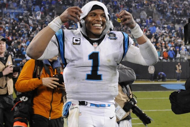 Carolina Panthers' Cam Newton celebrates after the second half of an NFL wild card playoff football game against the Arizona Cardinals in Charlotte, N.C., Saturday, Jan. 3, 2015. Carolina Panthers won 27-16. (AP Photo/Mike McCarn)