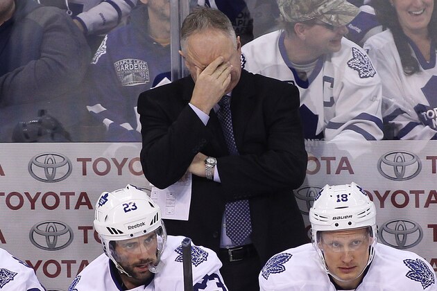 WINNIPEG, MB - JANUARY 3: Randy Carlyle, head coach of the Toronto Maple Leafs, rubs his eyes on the bench in third period action in an NHL game against the Winnipeg Jets at the MTS Centre on January 3, 2015 in Winnipeg, Manitoba, Canada. (Photo by Marianne Helm/Getty Images)