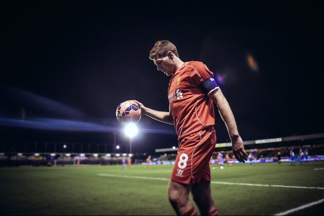 KINGSTON UPON THAMES, ENGLAND - JANUARY 05:  (EDITORS NOTE: Digital filters were used in the creation of this image.) Steven Gerrard of Liverpool prepares to take a corner during the FA Cup Third Round match between AFC Wimbledon and Liverpool at The Cherry Red Records Stadium on January 5, 2015 in Kingston upon Thames, England.  (Photo by Michael Regan/Getty Images)
