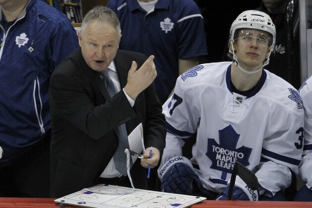Toronto Maple Leafs head coach Randy Carlyle calls out to his players during the third period of an NHL hockey game against the Minnesota Wild in St. Paul, Minn., Friday, Jan. 2, 2015. The Wild won 3-1. (AP Photo/Ann Heisenfelt)
